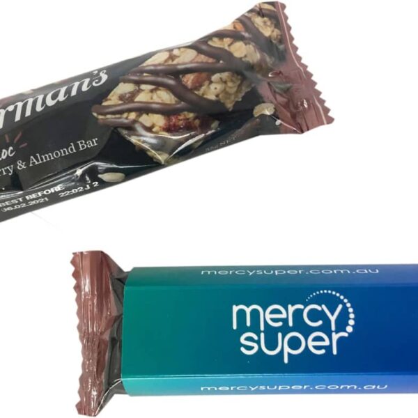 Two packaged snack bars, one labeled Carmans and one labeled Mercy Super.