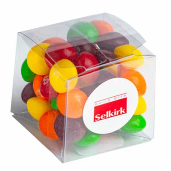 Clear box filled with colorful candy-coated chocolates, labeled with a Selkirk sticker.