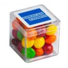 Clear cube with colorful candy inside and an American Express logo on the lid.