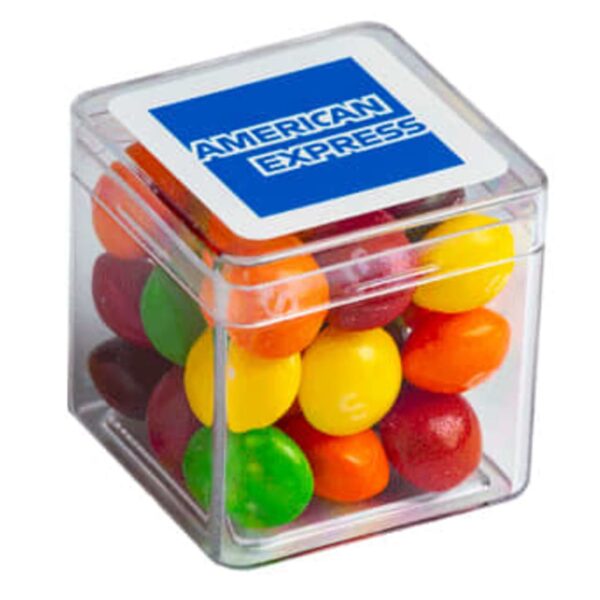 A clear box of colorful candy with an American Express logo on the lid.