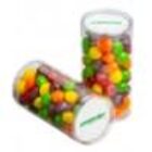 Two clear tubes filled with colorful round candies, mostly yellow, orange, red, green, and purple.