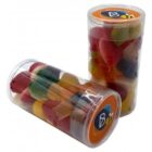 Two clear plastic tubs filled with colorful jelly or gummy candies with orange lids.