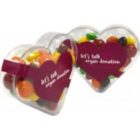 Two heart-shaped containers filled with colorful candy, labeled lets talk organ donation.