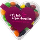 Heart-shaped box with colorful candy, labeled “let’s talk organ donation, donatelife.gov.au.”.