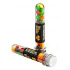 Two clear tubes filled with colorful candies, one standing upright and one lying down.