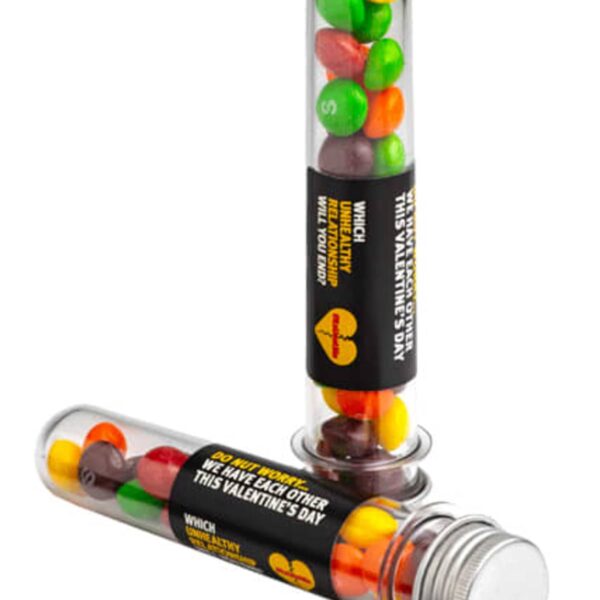 Test tubes filled with colorful candies, labeled for Valentines Day with playful messages.