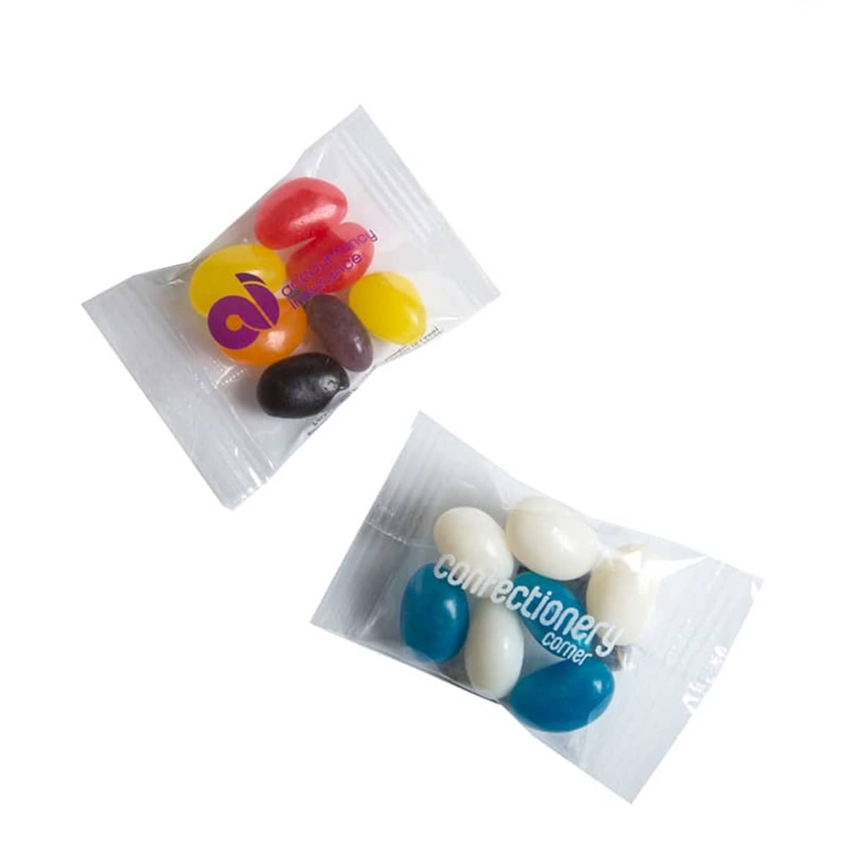 Two small clear packets of assorted jelly beans on a white background.