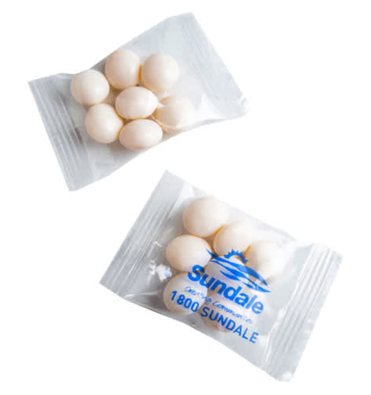 Two clear packets with six white candies each, one packet labeled “Sundale.”.