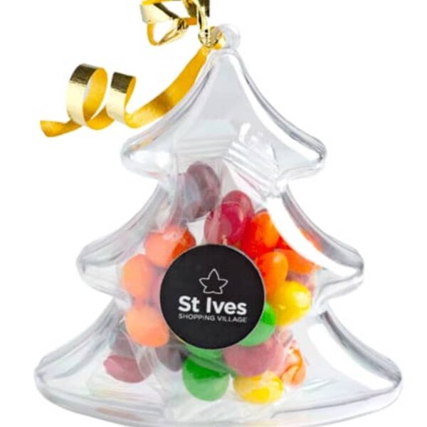 Clear plastic Christmas tree ornament filled with colorful candy and a gold ribbon on top.