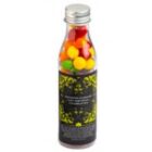 A clear bottle with a silver cap, filled with colorful round candies.