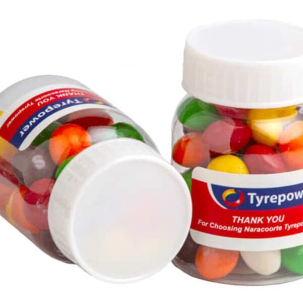 Two jars of colorful jellybeans with Tyrepower labels on white background.