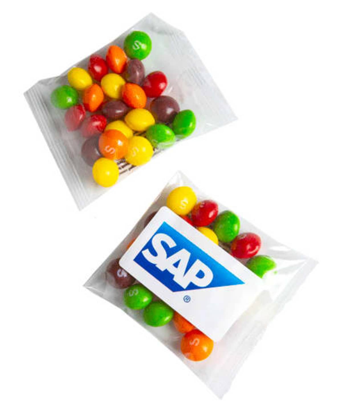 Two clear packets of colorful Skittles, one with an SAP logo sticker on the front.