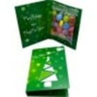 Green Christmas card with a tree design, open to show colorful candies inside.