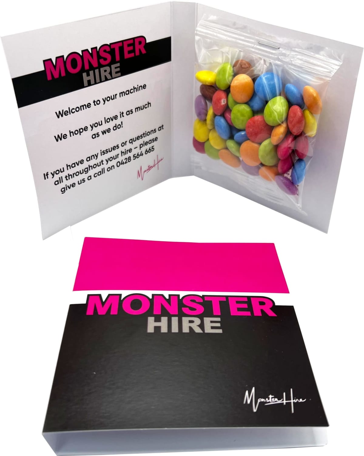 A Monster Hire welcome card with a small bag of colorful candies inside.