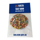 A bag of colorful candy sprinkles with SES contact details and website on the packaging.