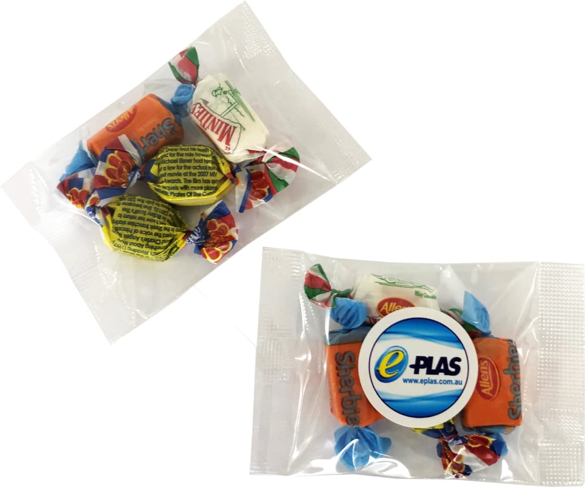 Assorted wrapped candies in clear plastic bags, one with an ePlas logo sticker on it.