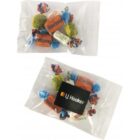 Two clear bags of assorted wrapped candies, one with an LJ Hooker logo sticker.