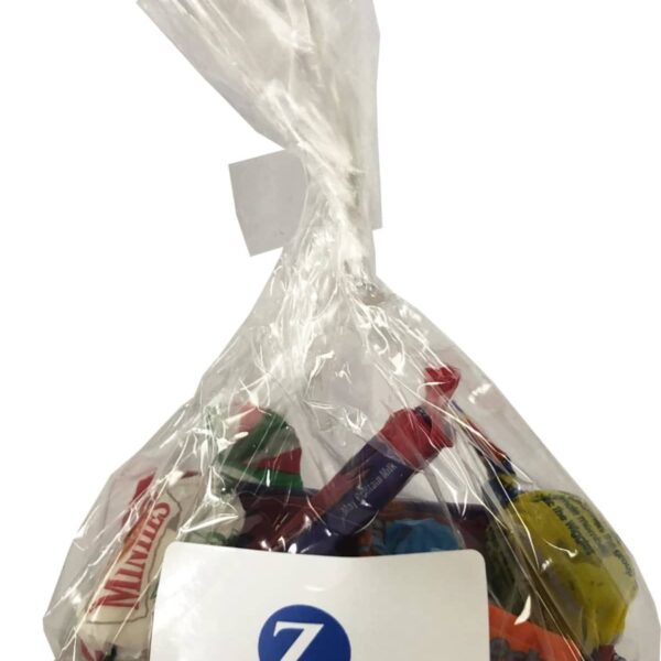 A clear bag of assorted candies with a Zurich label on the front.