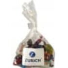A clear plastic bag of colorful candies labeled Zurich.
