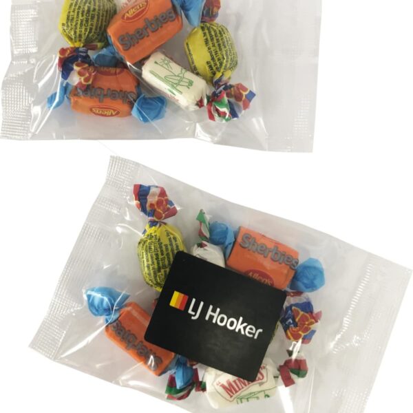 Small bag of assorted wrapped candies with an LJ Hooker branded card inside.