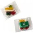 Two small clear packets containing colorful gummy candies, one with a green label.