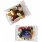 Two clear plastic bags filled with assorted gummy candies, one with a blue label.