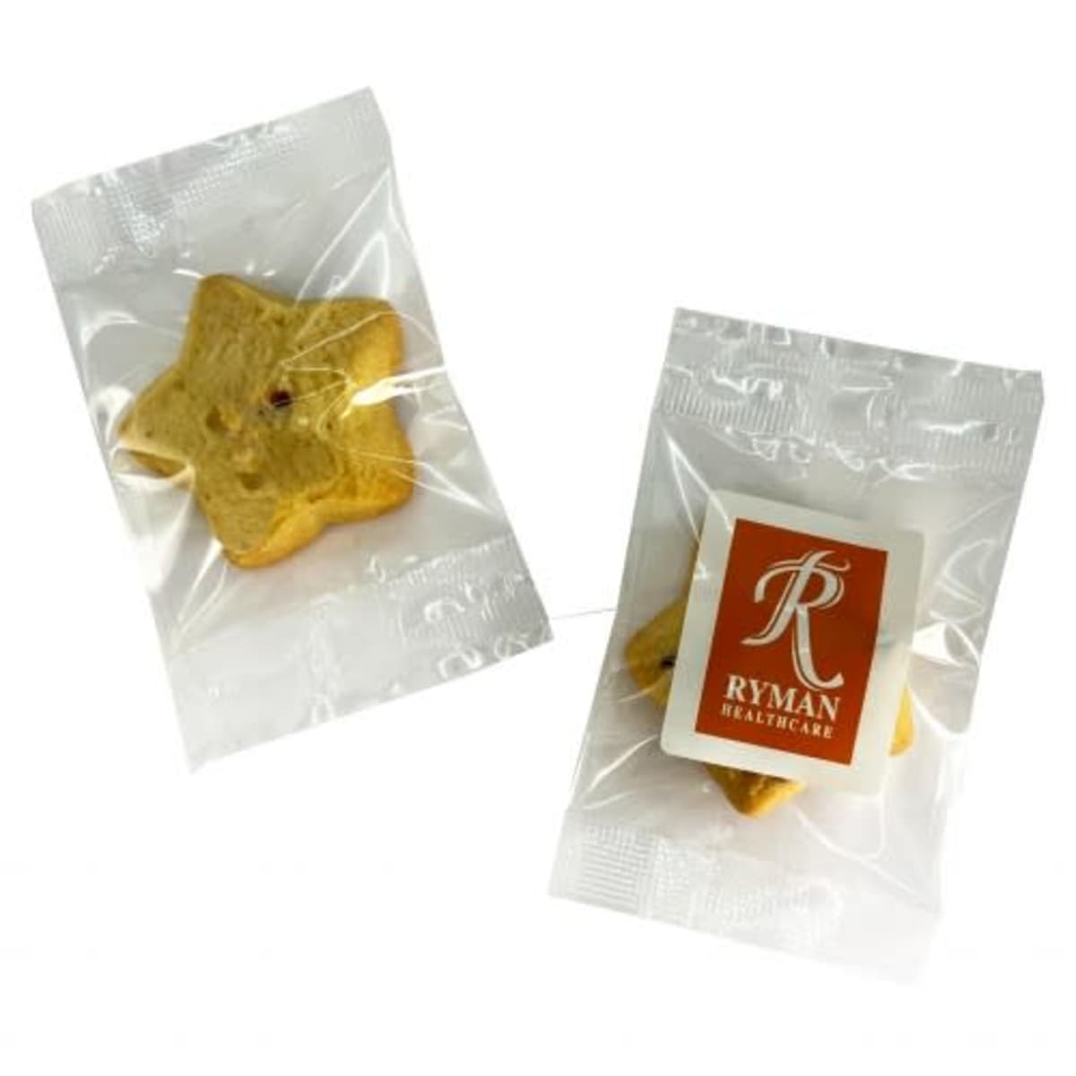 Two star-shaped cookies in clear plastic wrappers, one with a Ryman Healthcare label.