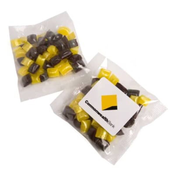 Two clear bags of yellow and brown candy, one with a Commonwealth Bank label on it.