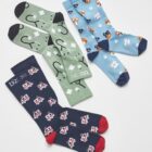Three pairs of colorful medical-themed socks on a white background.