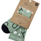Green socks with stethoscope pattern, packaged with a bizcare label.