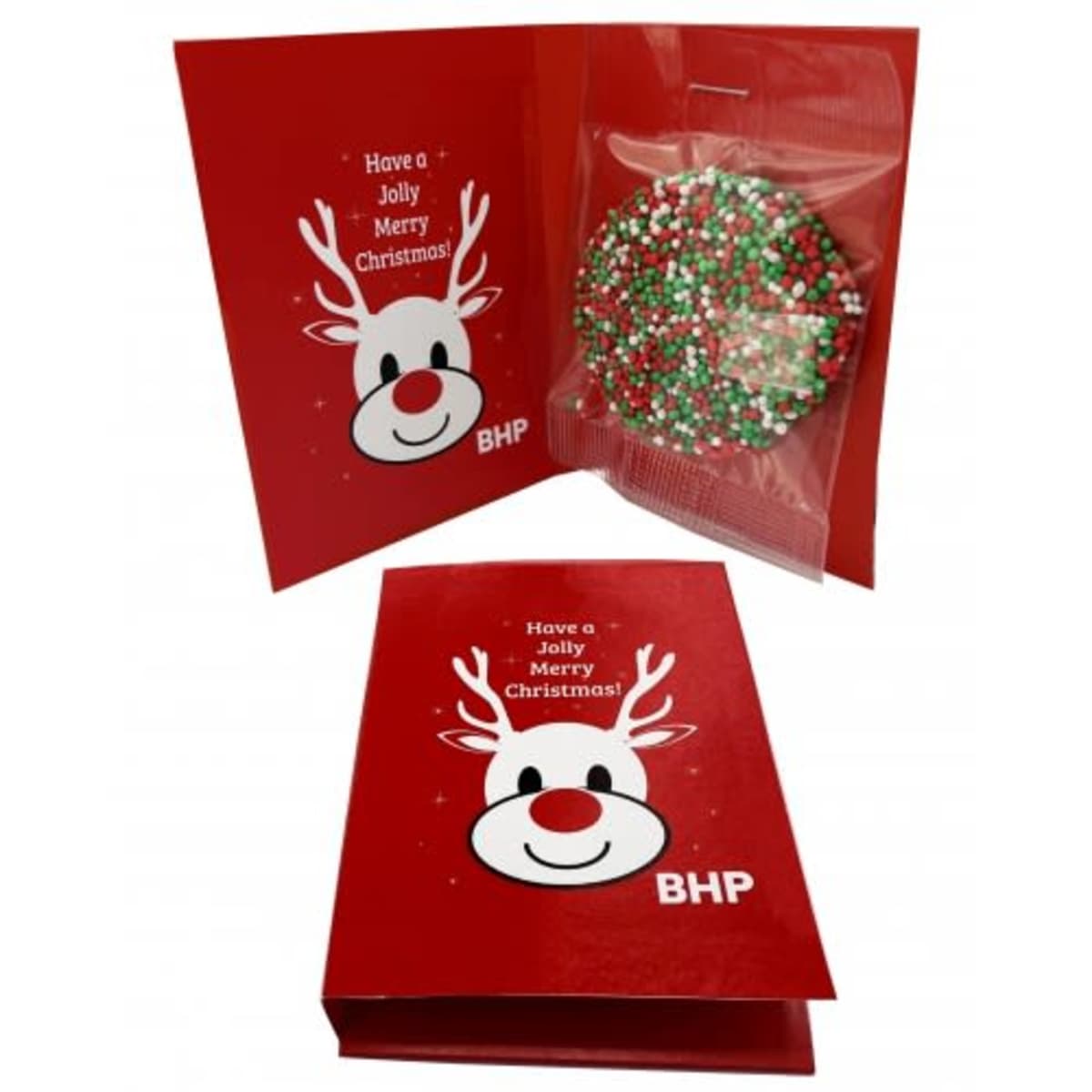 Red Christmas card with a cartoon reindeer face and a chocolate treat inside, decorated with sprinkles.