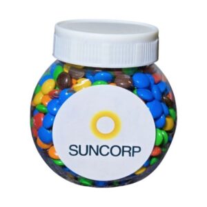 Round jar with colorful candies and a label reading SUNCORP.