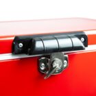 A close-up of a red metal box with a black handle and a locked silver latch.