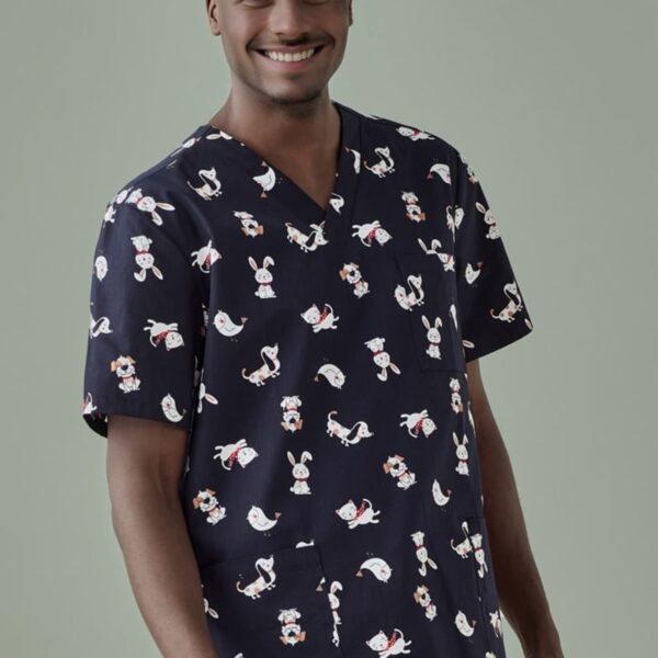 Smiling person in animal-patterned scrubs against a light green background.