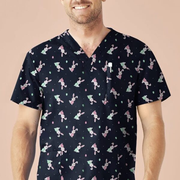 Man wearing a scrub top with a playful rabbit pattern, smiling.