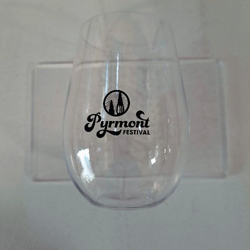 Transparent glass with Pyrmont Festival logo against a light background.