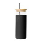 Black glass tumbler with a wooden lid and metal straw.