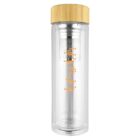 Clear glass tea infuser bottle with bamboo lid and orange geometric design.