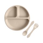 Beige divided baby plate with matching spoon and fork on a white background.