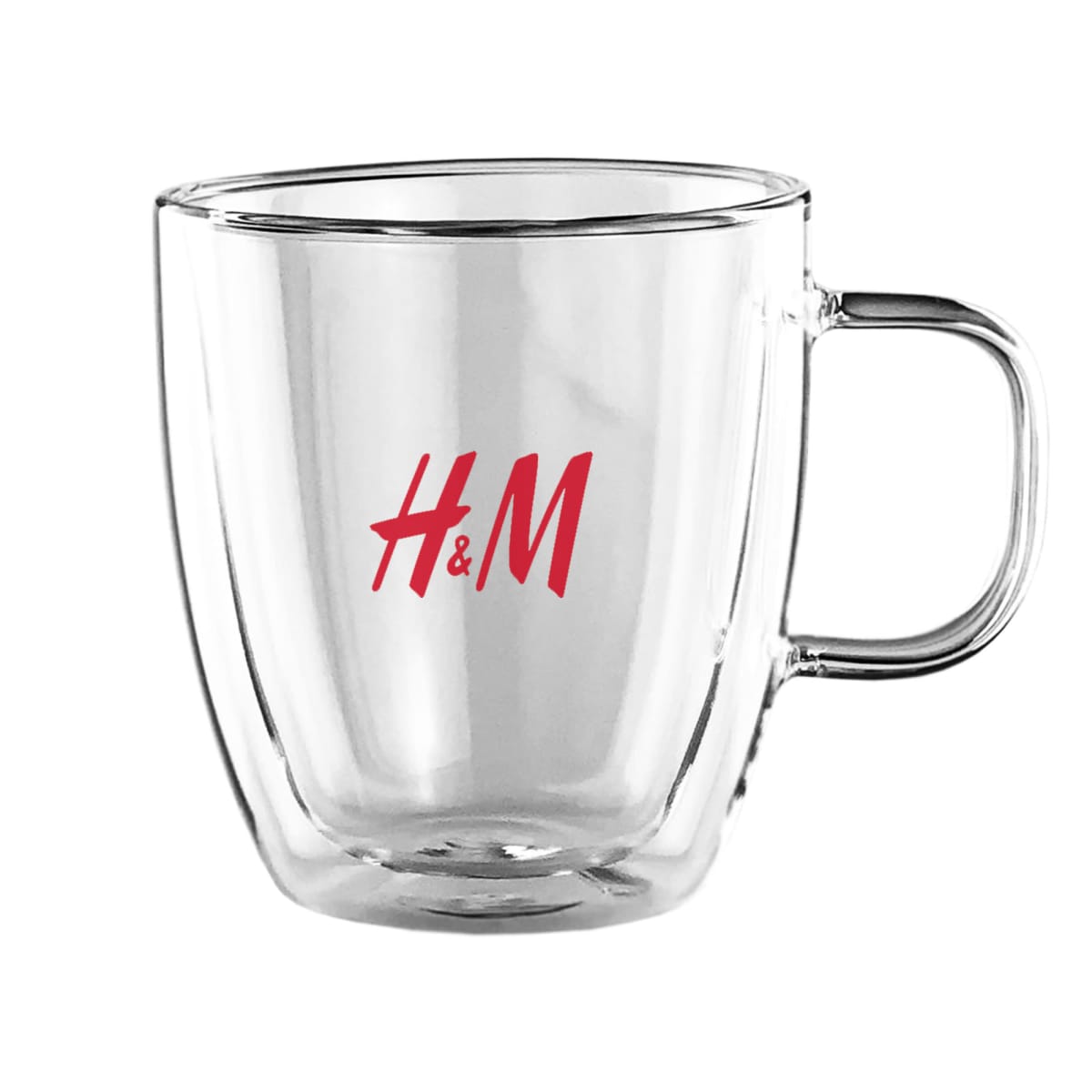 Clear glass mug with H&M in red lettering.