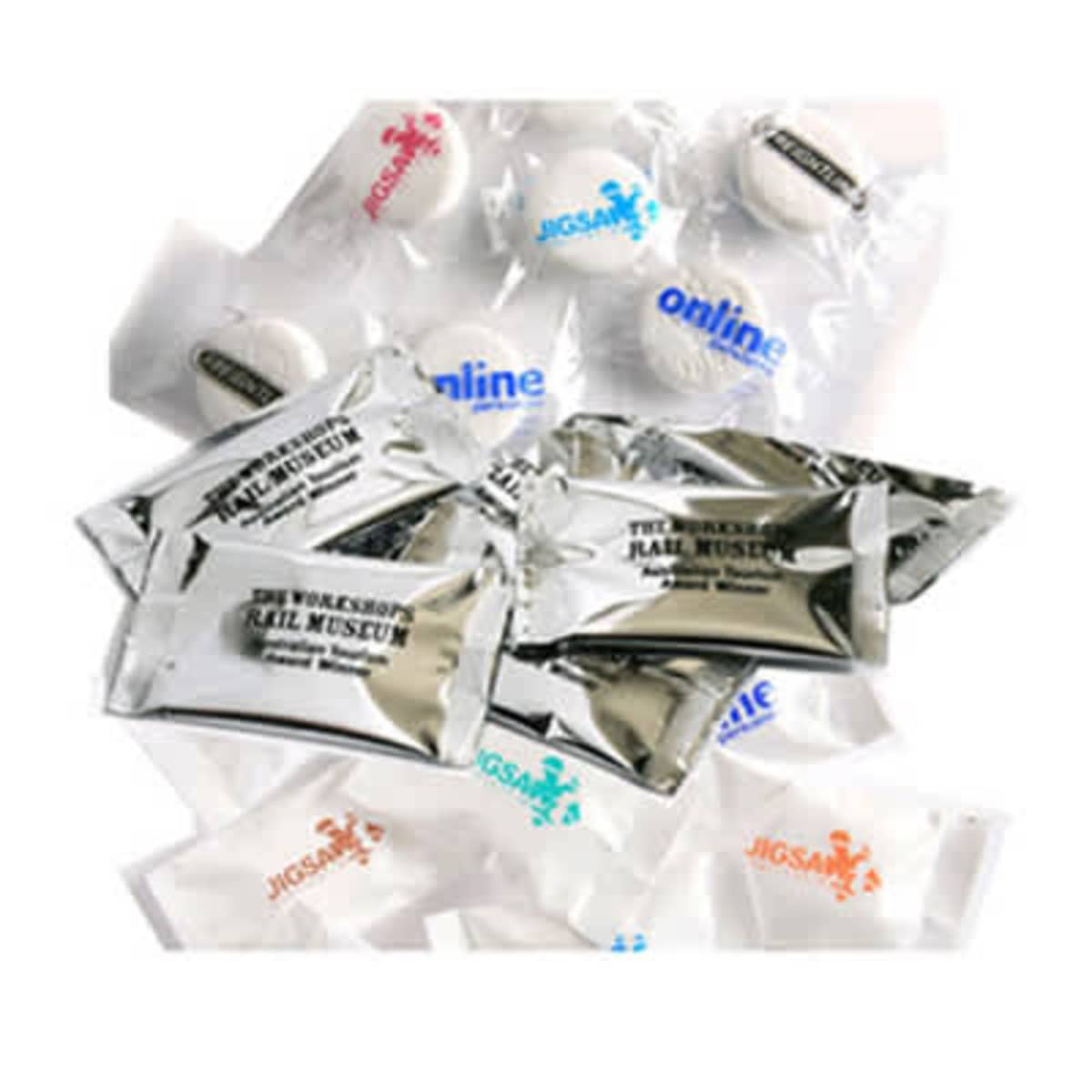 Individually wrapped mints in silver and clear packaging with various printed logos.