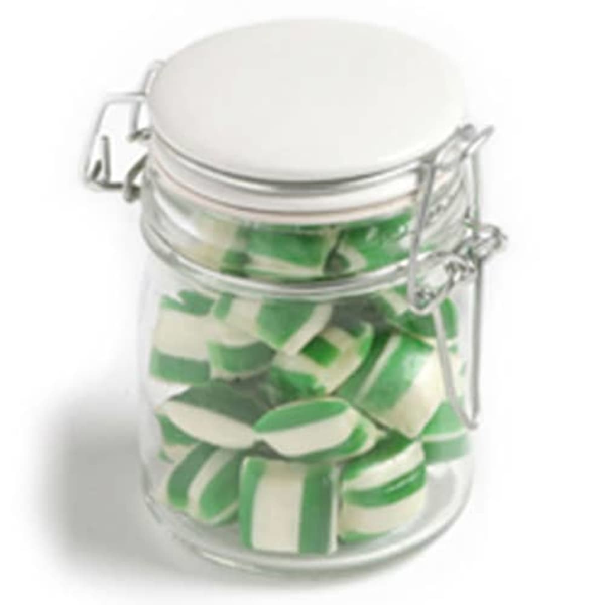 Glass jar filled with green and white striped candies, sealed with a metal clasp lid.