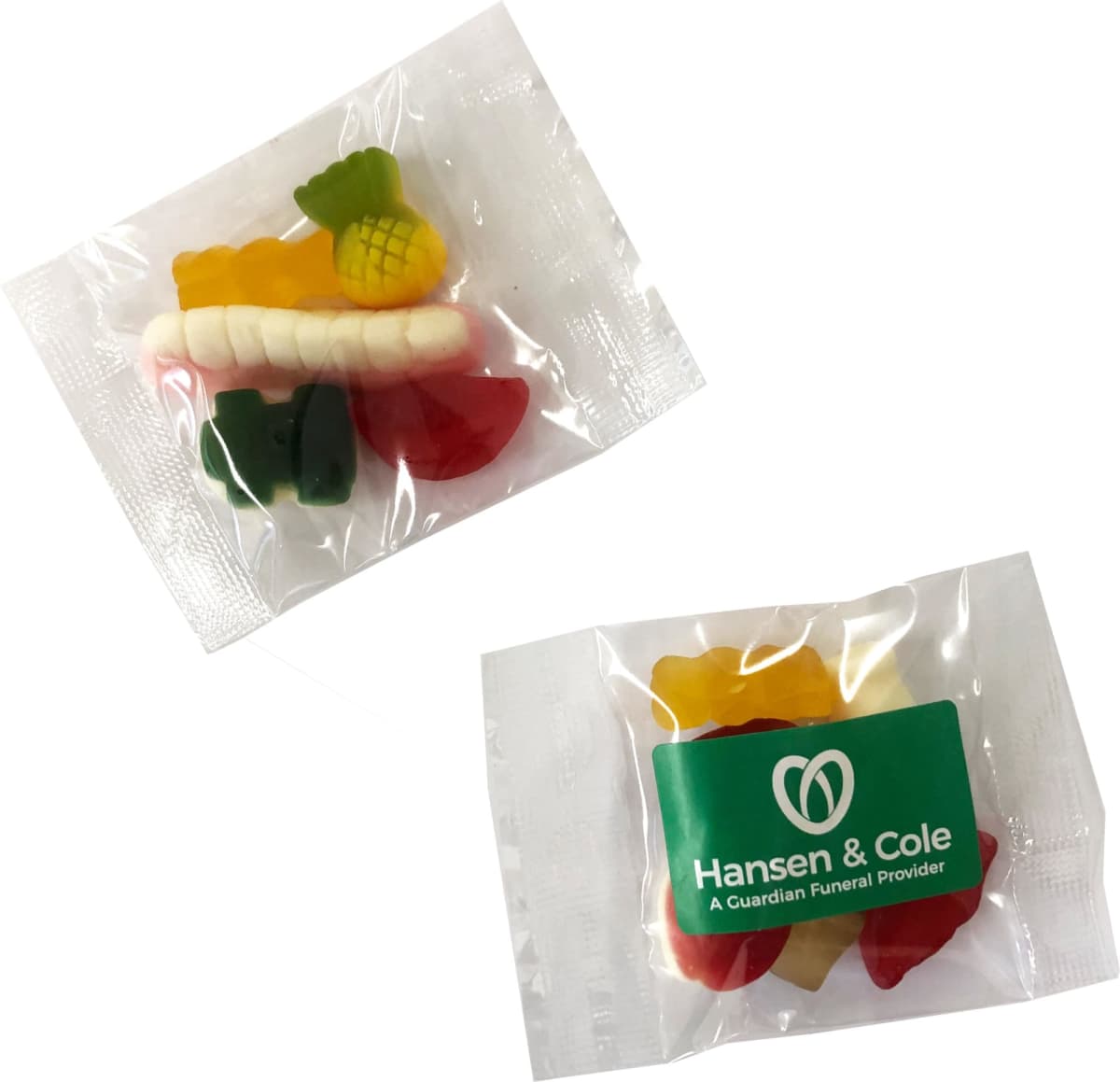 Two clear packets of assorted gummy candies, one labeled Hansen & Cole.