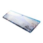 Rectangular travel-themed desk mat with cityscape and mountain design.