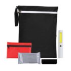 Emergency kit with pouches, flashlight, and a foil-wrapped item.