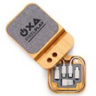 Wooden charging kit with multiple connectors labeled OXA Pixel Play.