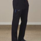 Person wearing black work pants with pockets, blue shirt, and slip-on shoes.