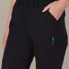 Person wearing black cargo shorts with a green pen in the side pocket.