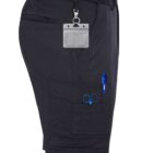 Person wearing dark shorts with pockets containing a pen and scissors, ID tag attached.