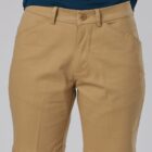 Person wearing tan shorts and a dark teal shirt.